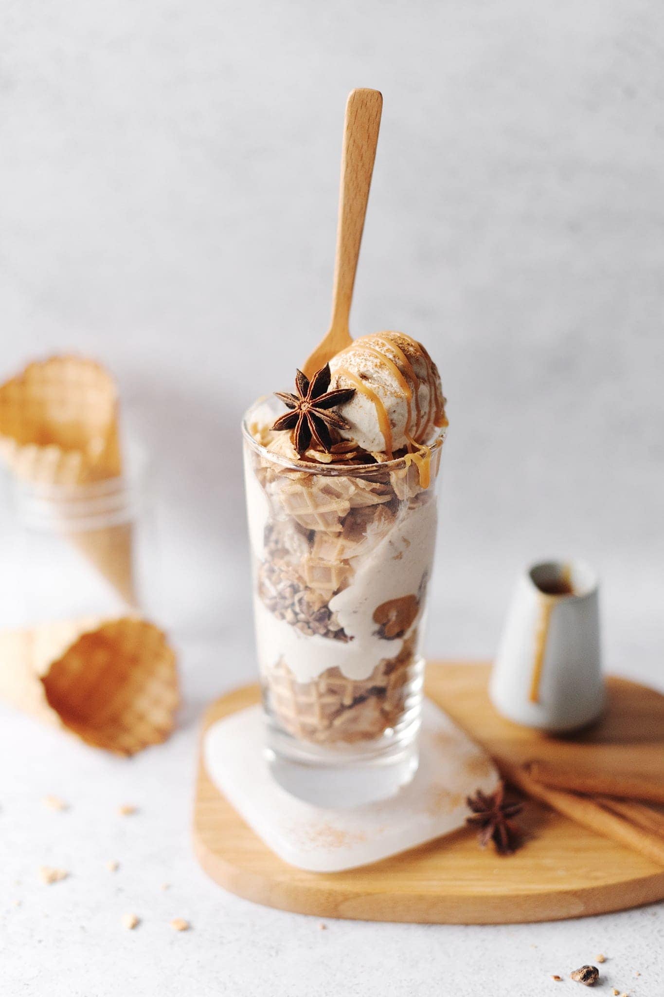 Chai spiced ice cream parfait layers in a tall glass