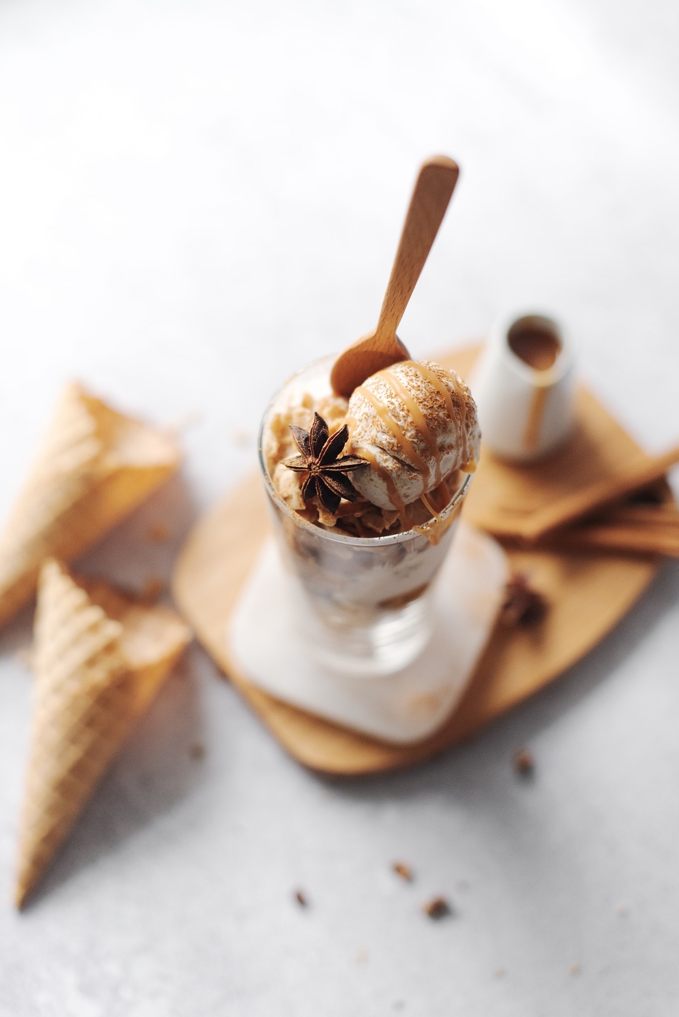 Chai spiced ice cream drizzled with caramel sauce and star anise
