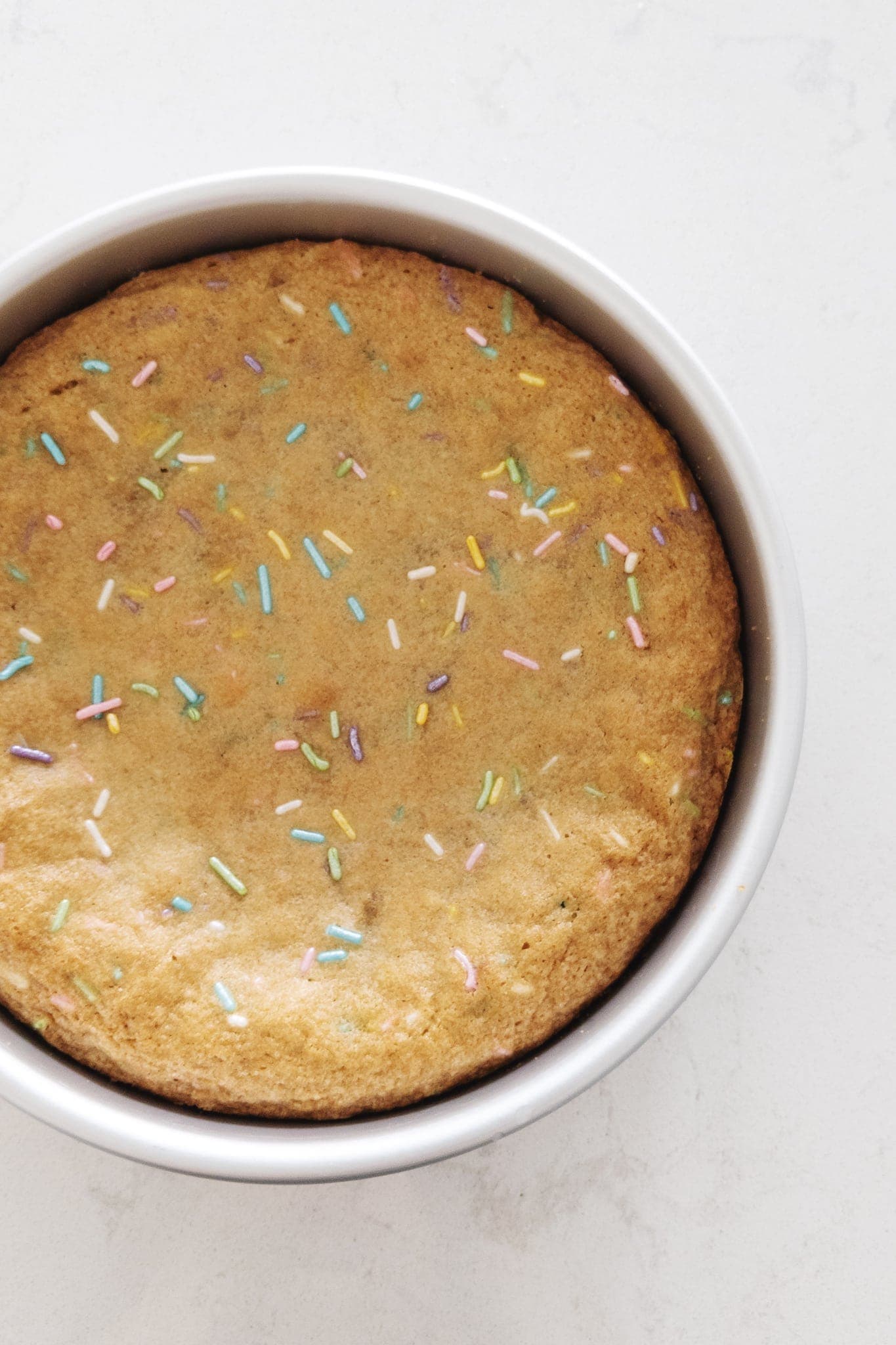 Baked cookie cake with sprinkles on top