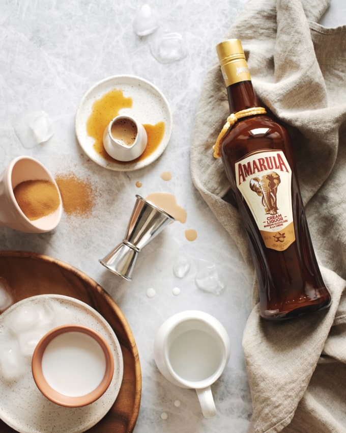 Amarula bottle and coffee spilled on table