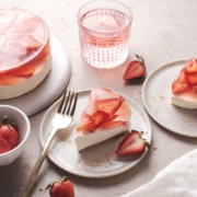 A slice of strawberry jelly cheesecake with translucent surface