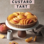 Peach custard tart on a cake stand