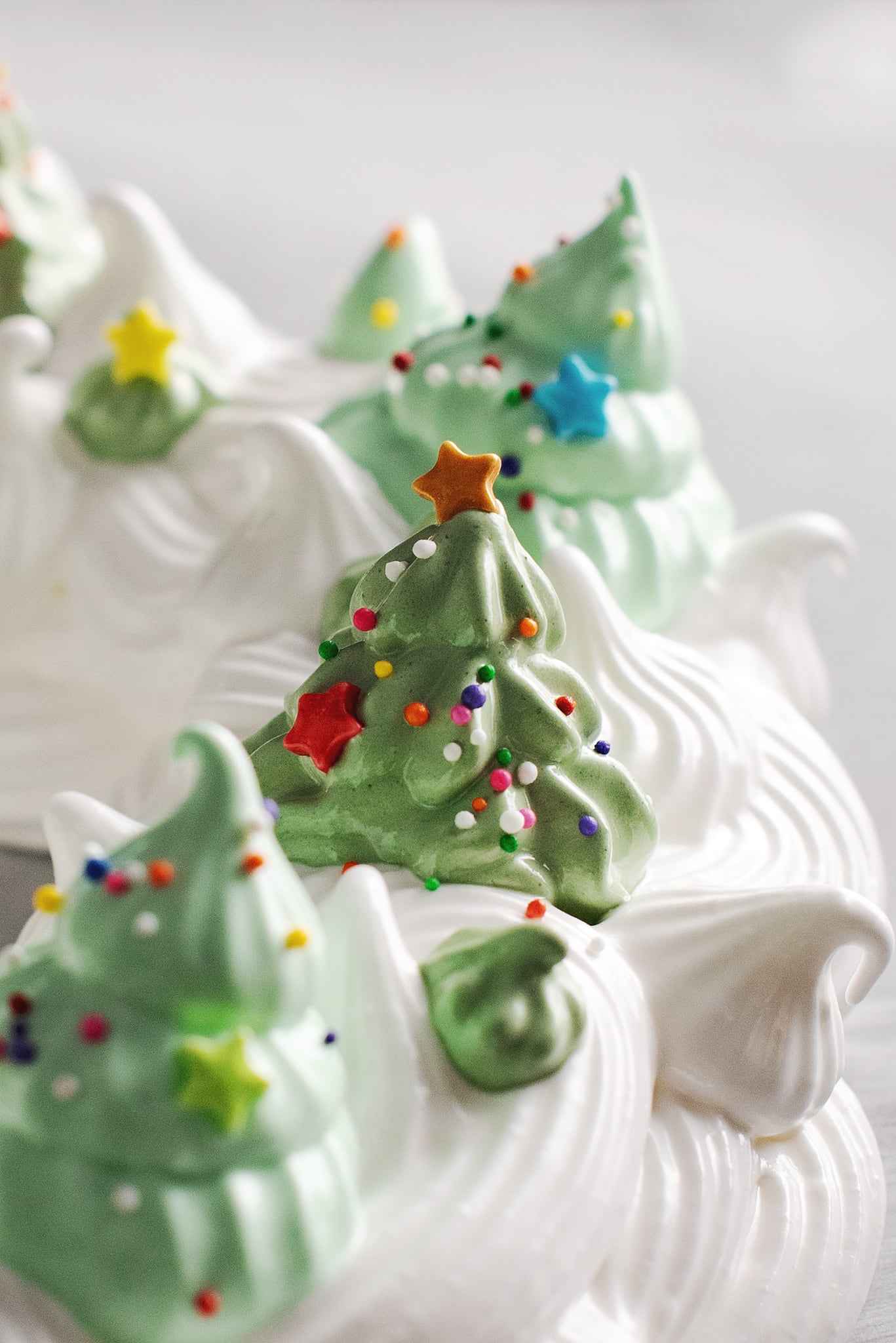green meringue christmas tree decorated with sprinkles