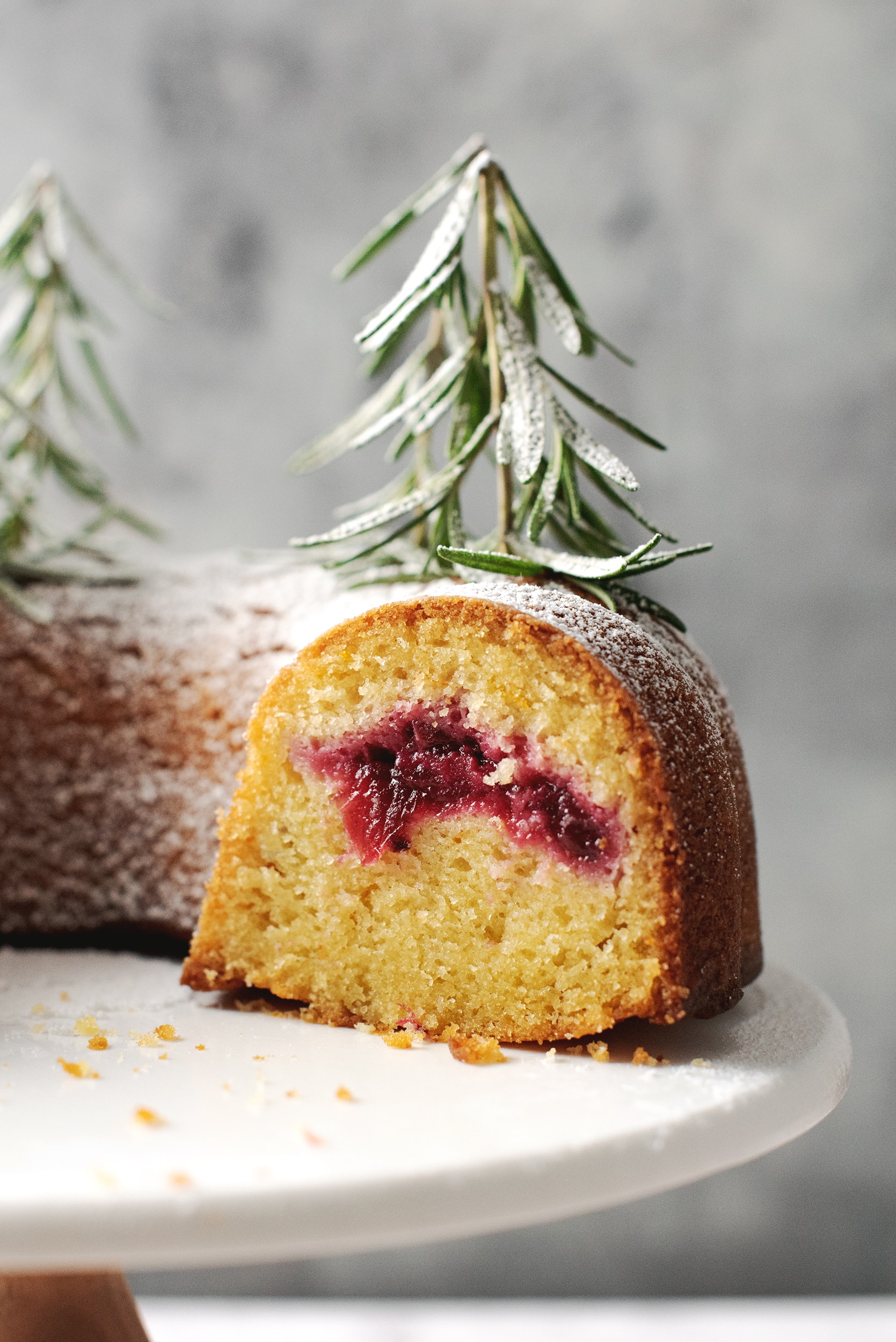 close up of cranberry sauce filling in the middle of orange bundt cake
