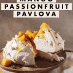 lifting a slice out of mango passionfruit pavlova