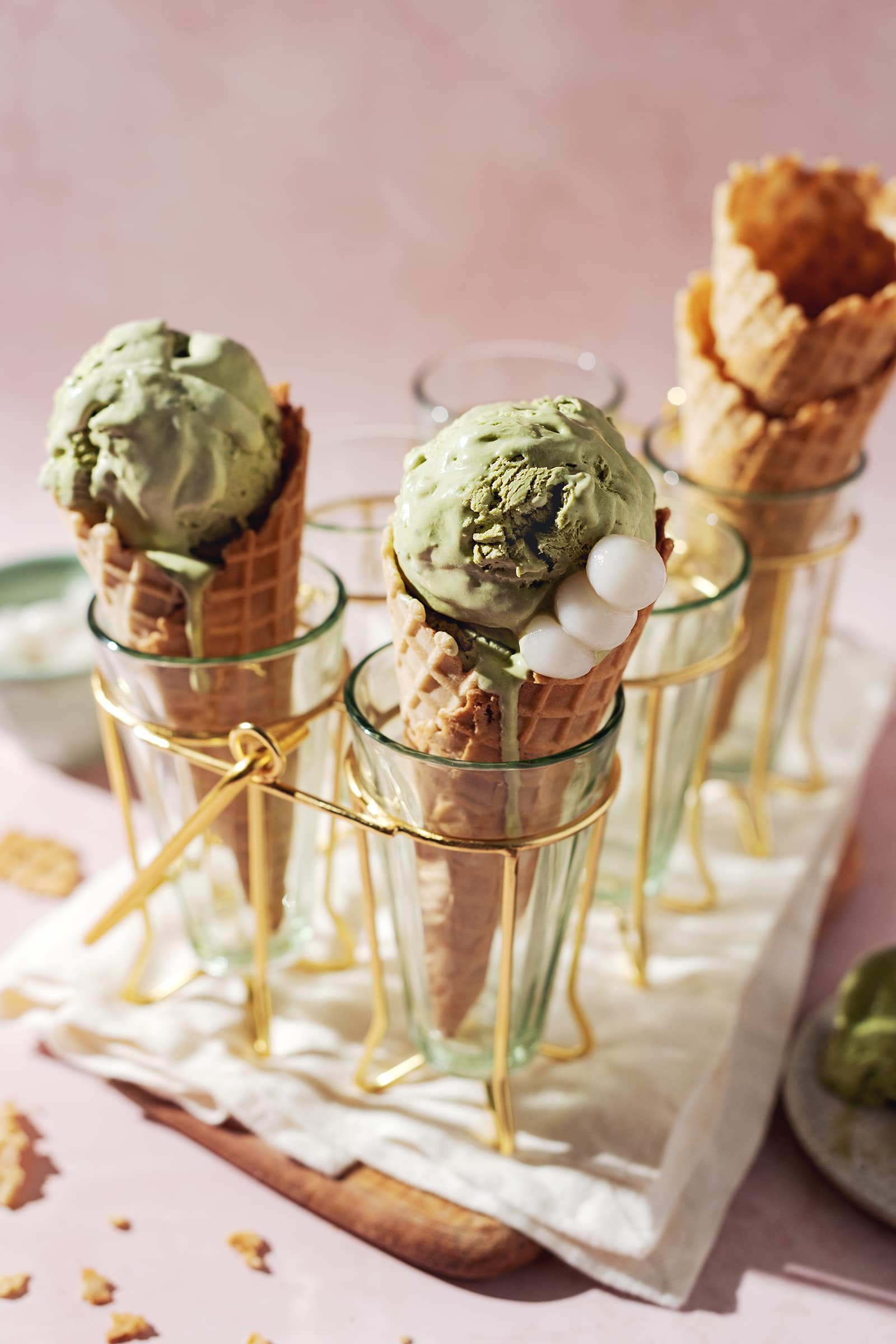 matcha ice cream with dango mochi in a waffle cone