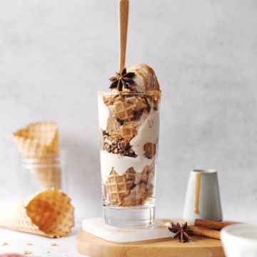 Ice cream parfait with a wooden spoon sticking out