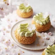 Matcha cream puffs surrounded by cherry blossoms