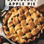 A lattice apple pie on a plate with a text overlay that says “crispy & flaky blueberry apple pie”.