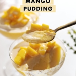 A spoonful of mango pudding being lifted from a glass cup.