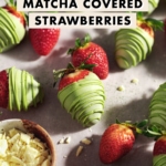 Strawberries dipped in green matcha white chocolate scattered on table with fresh strawberries.