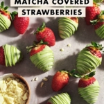 Matcha-covered strawberries scattered on table with fresh strawberries and a bowl of white chocolate.