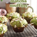 Matcha muffins topped with sliced almonds sitting on a wire rack.