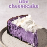A single slice of ube cheesecake on a plate.