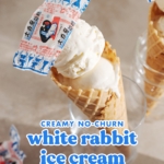 White rabbit ice cream cone in a glass with candy wrapper on top of it.