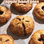 Mini apple hand pie with filling dripping out of it.