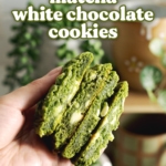 Hand holding four matcha cookies cut in half to show the gooey insides.