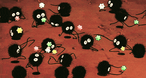 Soot sprites running around holding star-shaped konpeito candy.