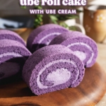 Slices of ube cake rolls lined up on a wooden platter.