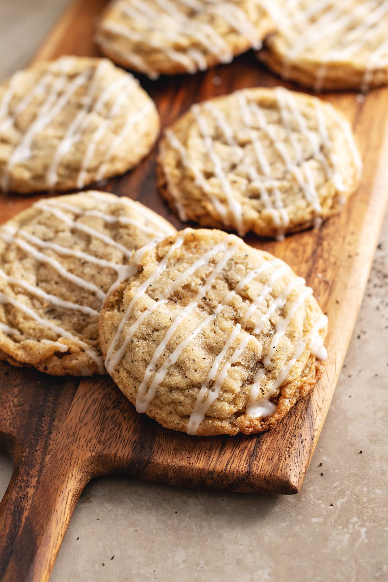 Earl grey sugar cookies sitting on a wooden board.