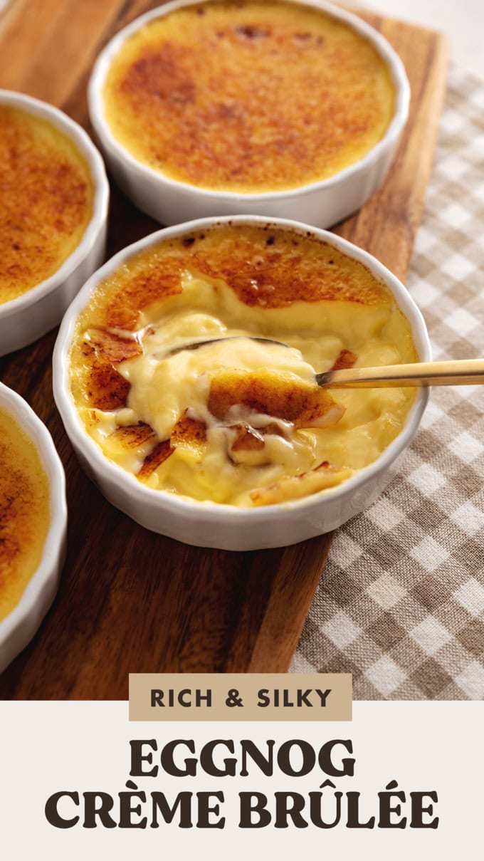 A ramekin of eggnog crème brûlée showing the custard underneath the caramelized sugar.