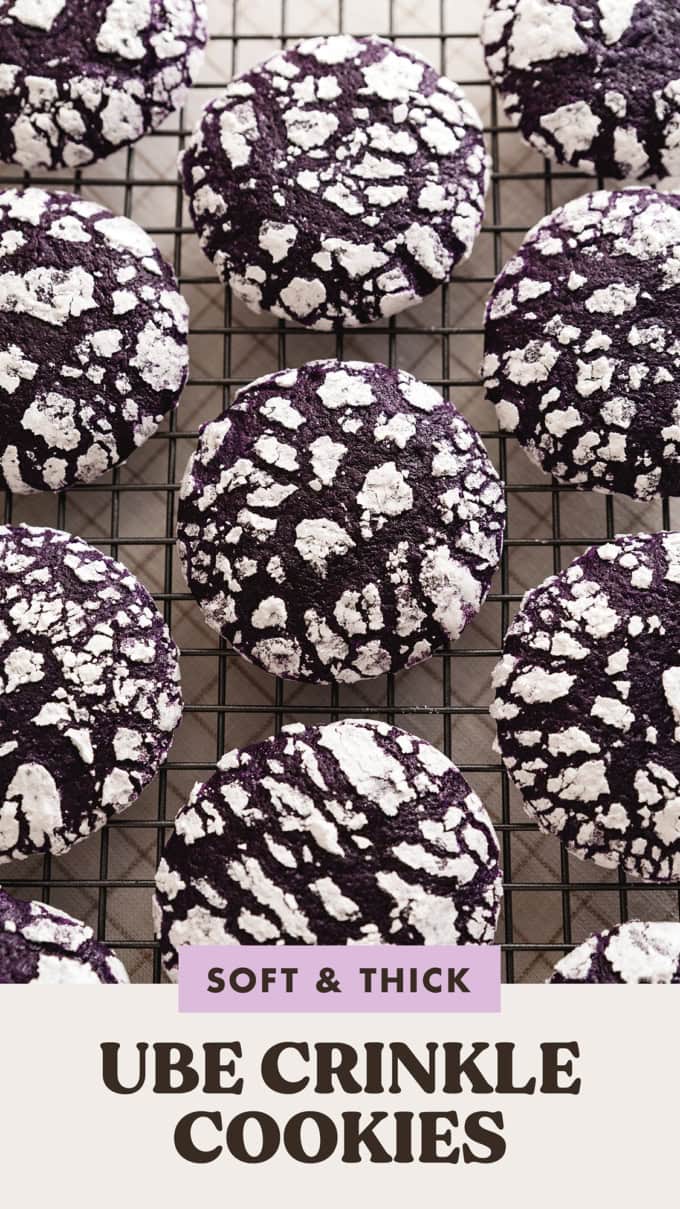 Top down view of ube crinkle cookies lined up on a wire rack.